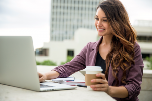 Woman drinking coffee on Facebook